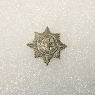 Collar badge 4/7th dragoon